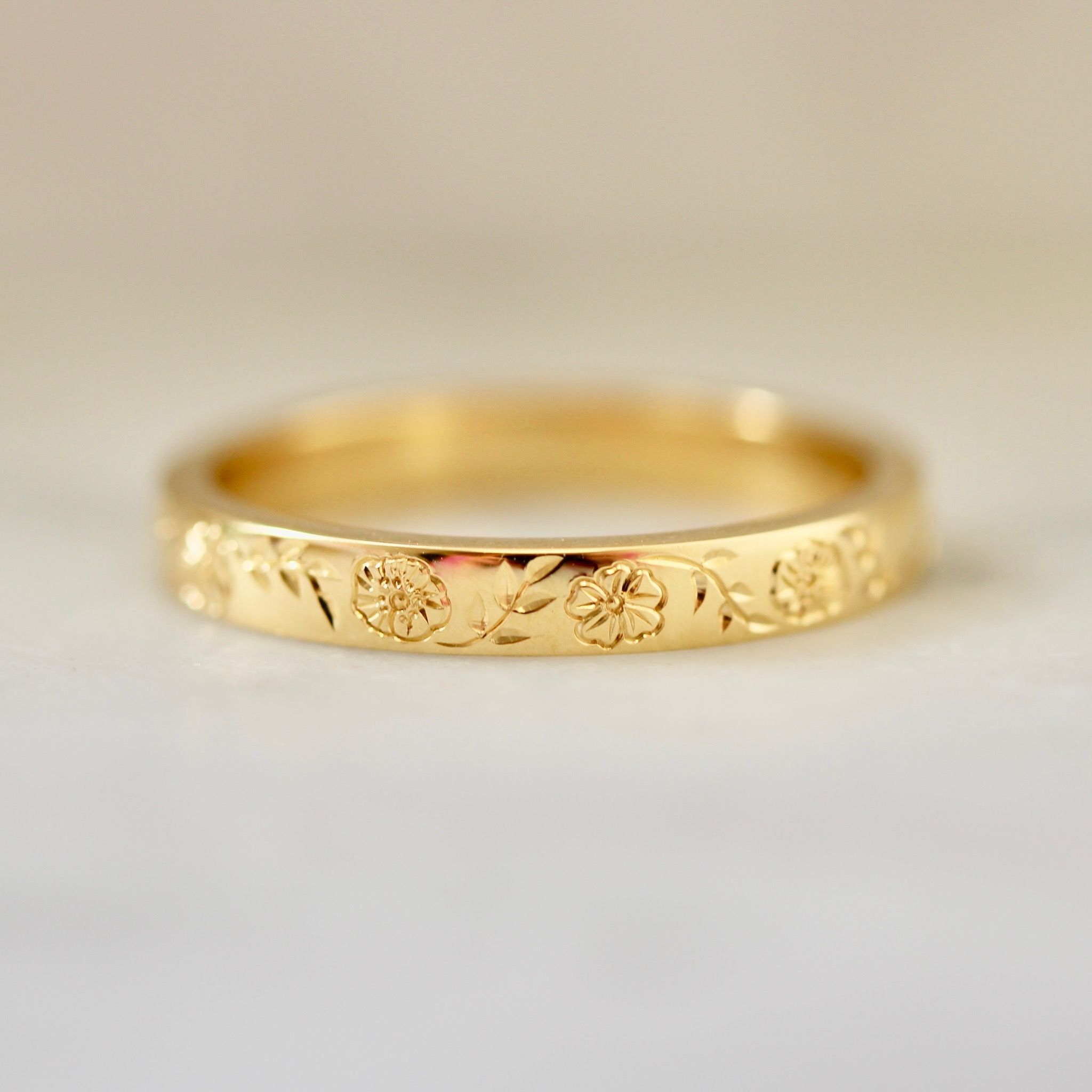 Floral hand-engraved wedding band