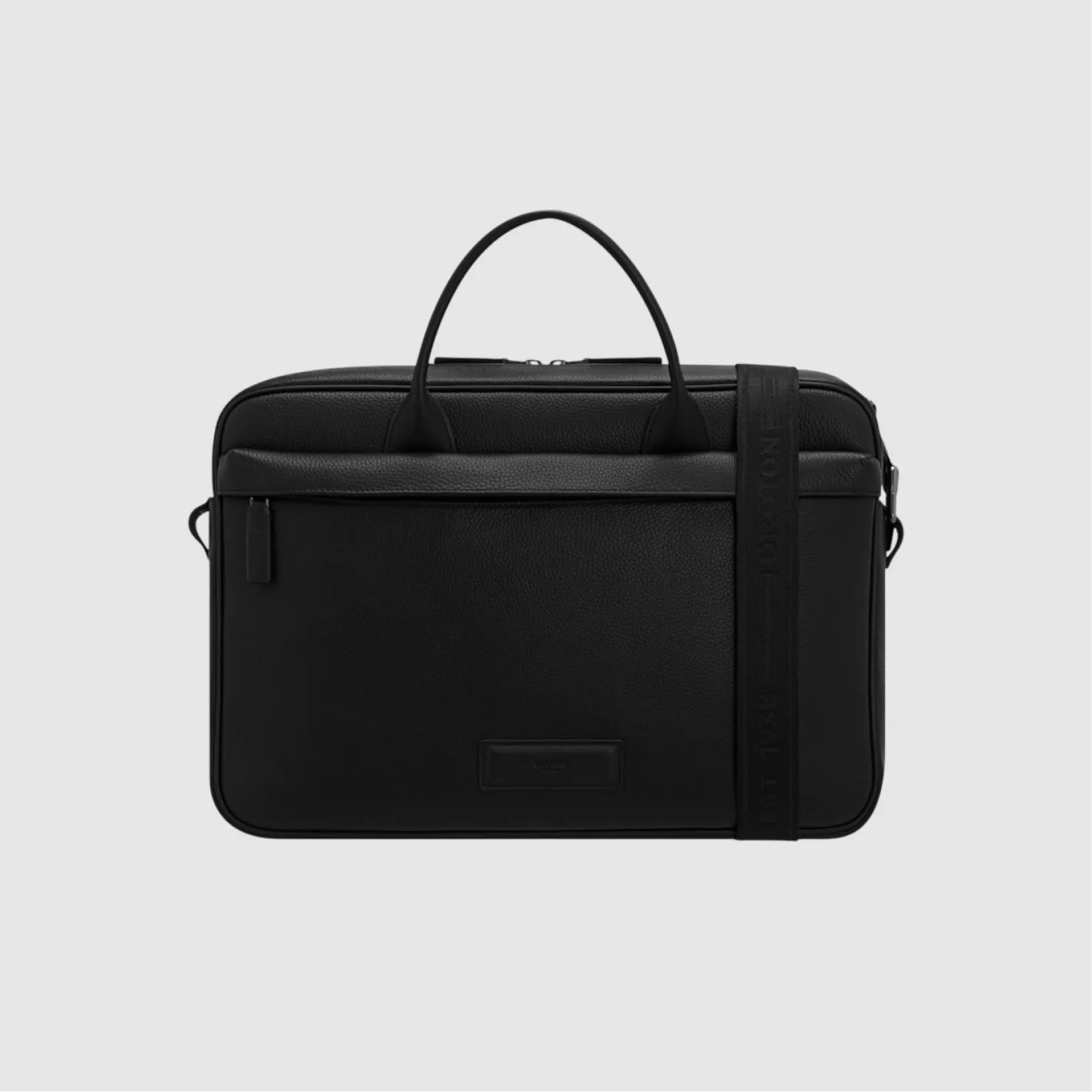 Black laptop bag with handle and shoulder strap on a gray background.