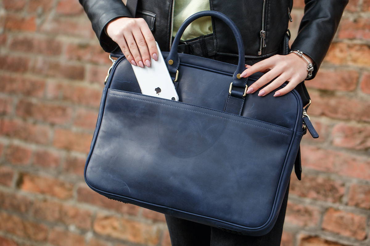 blue laptop bag in hand