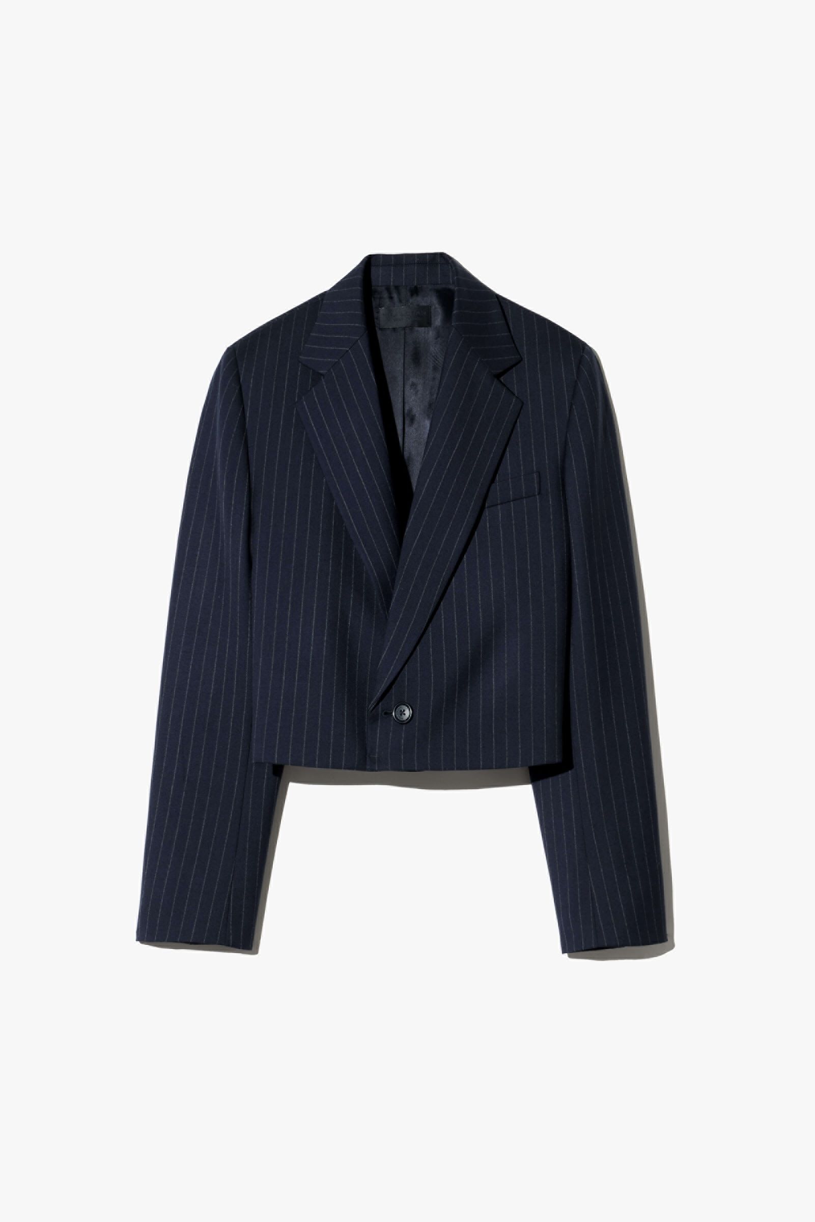 Navy pinstripe cropped blazer with a double-breasted front and structured shoulders.