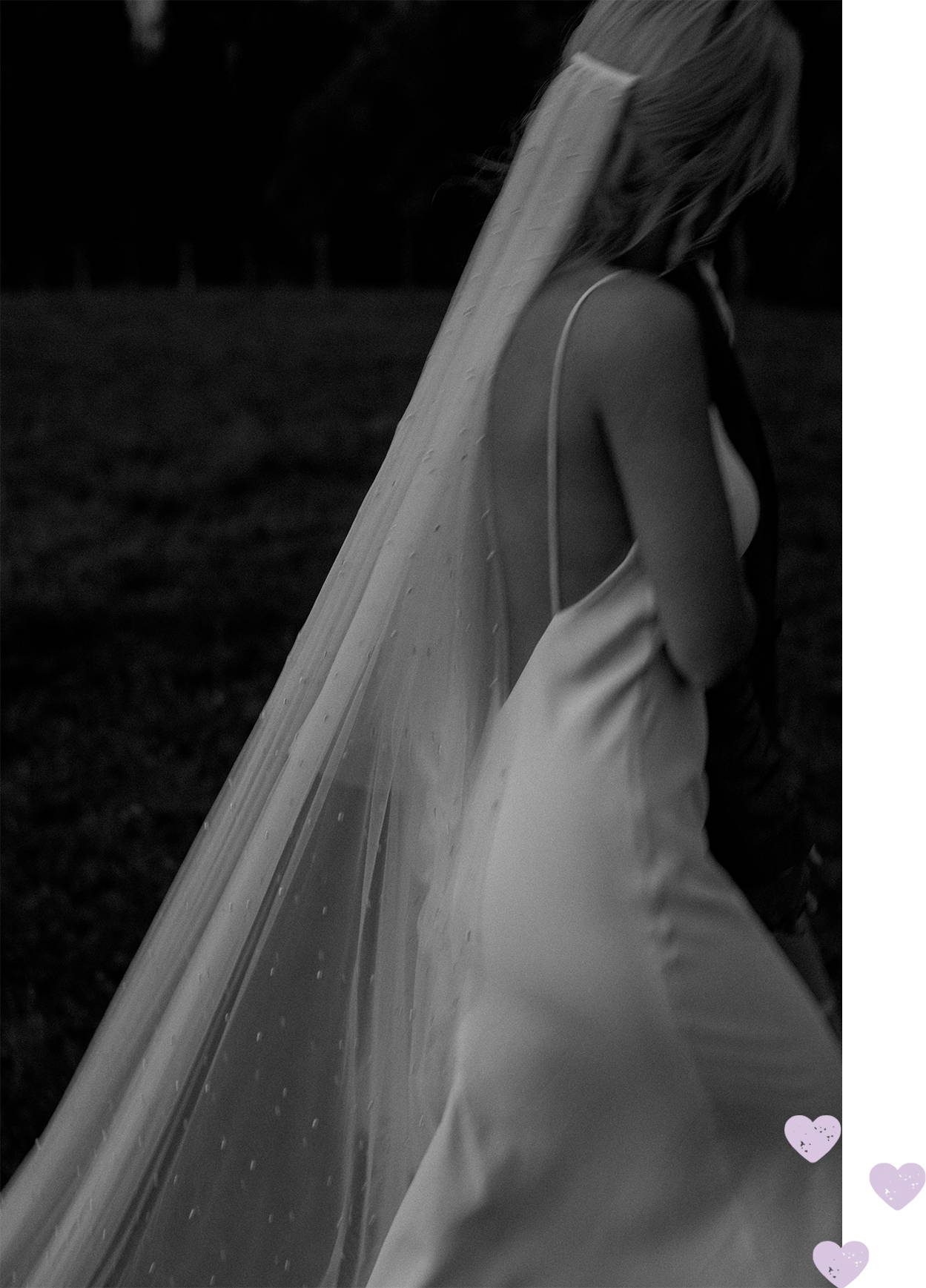 Bride wearing a low back thin strap silk dress and tulle pearl veil