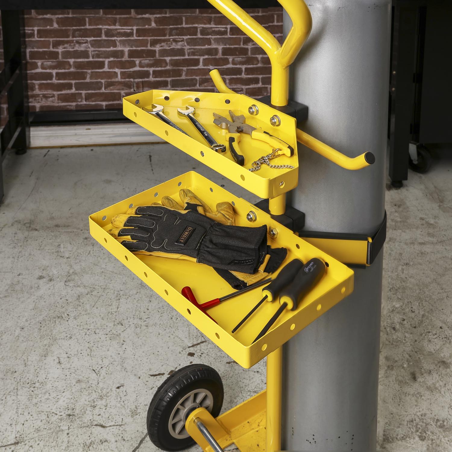 Yellow tool cart with shelves holding tools and gloves.
