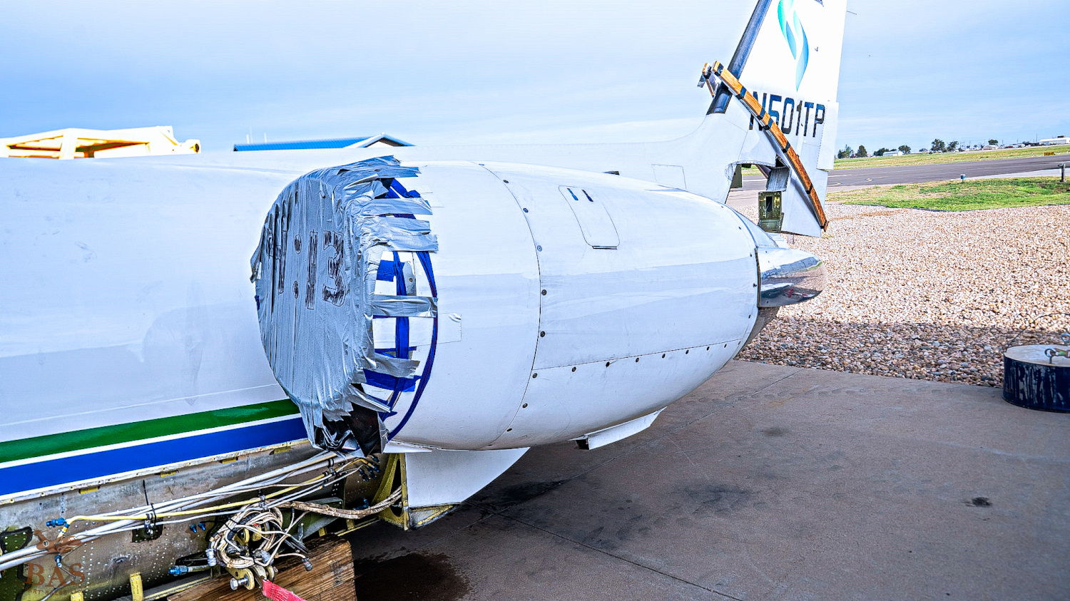 Close-up of an aircraft engine mounted on a plane.