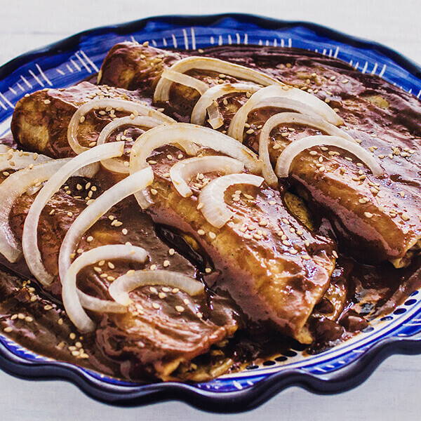 High Quality Organics Express Mole Enchiladas with onions