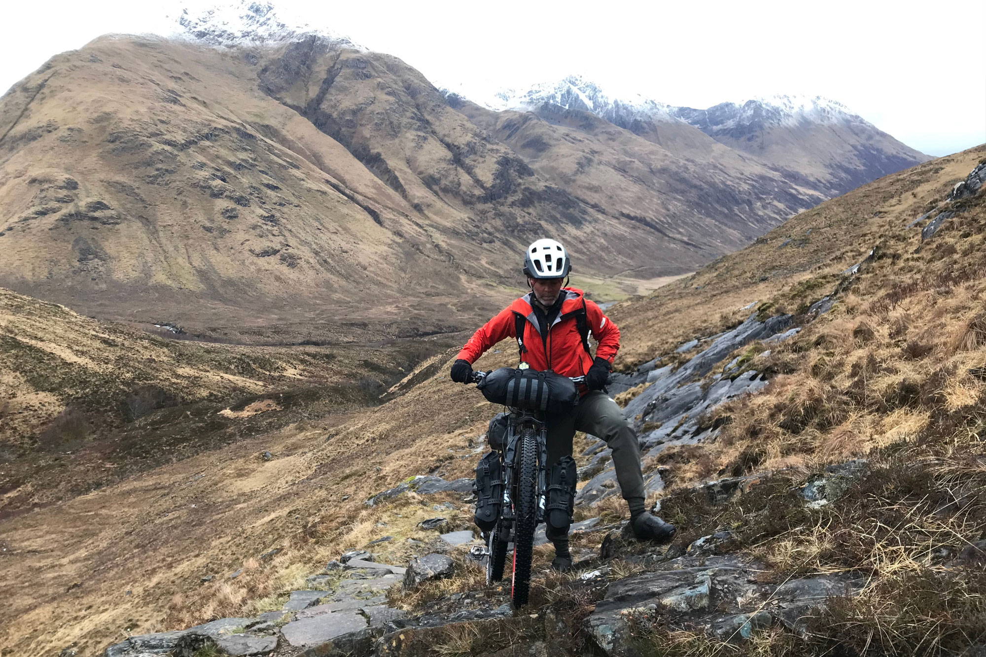 Rich hiking his bike at Glen Affric