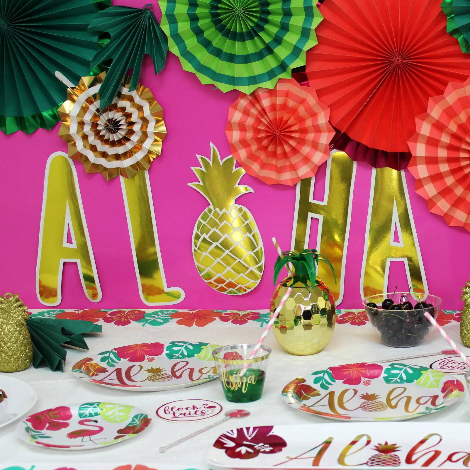 Decorations and table setting in aloha Hawaiian themed decor.