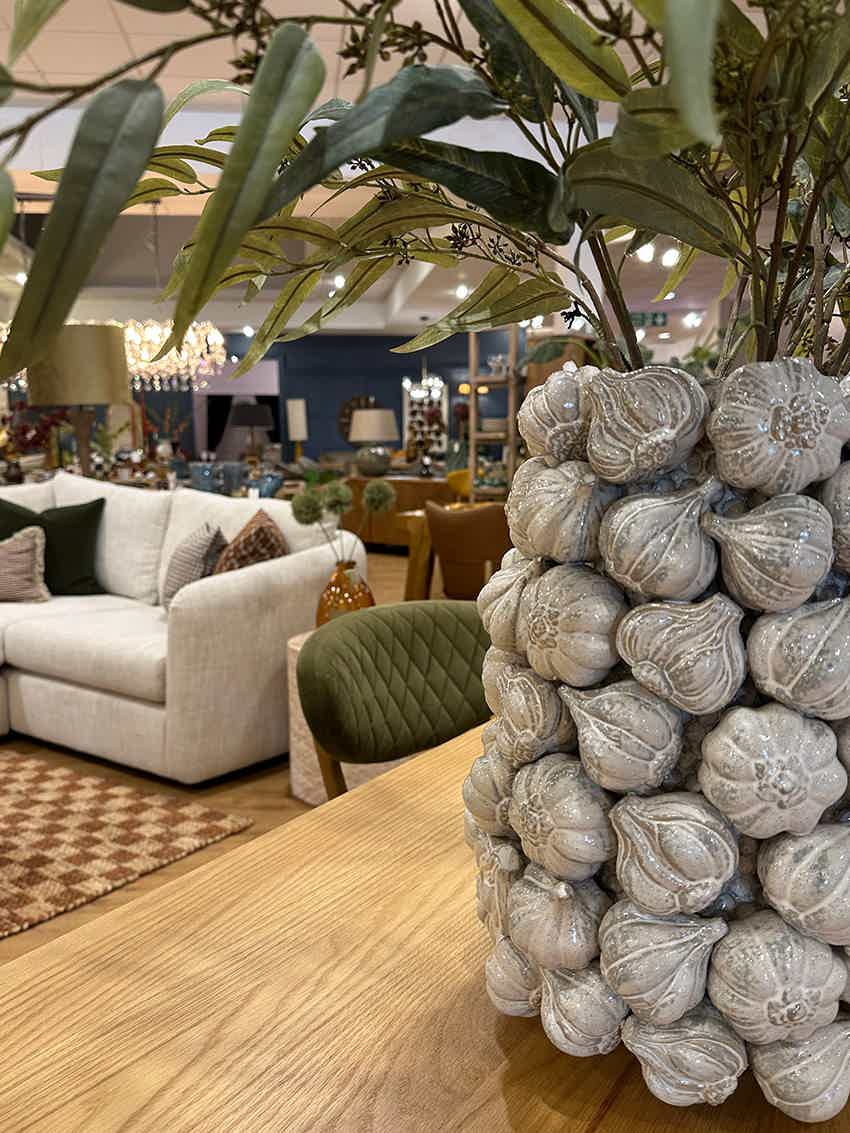 Onion style vase in front of a comfy sofa on display at BF Home furniture store in Norwich
