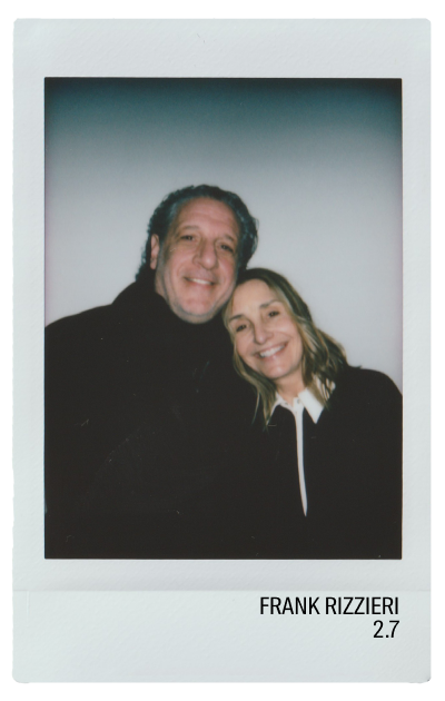 Two smiling individuals posing closely for a photo.