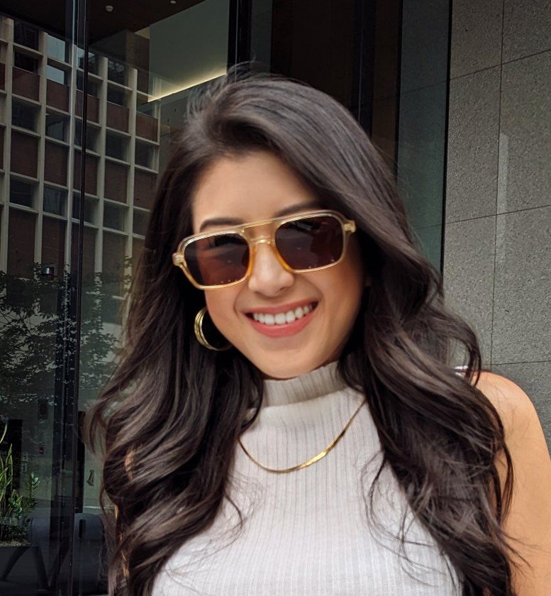 Woman with round face wearing squared aviator sunglasses