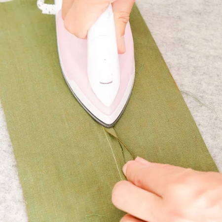 Press down with a hot mini iron