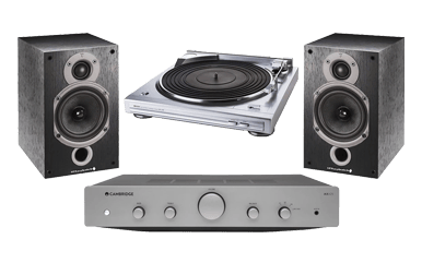 Turntable with speakers and amplifier in a modern audio setup.