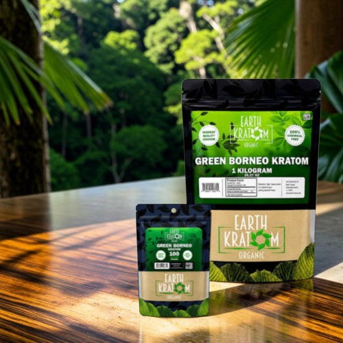 Two kratom product packages on a wooden table with a green background.