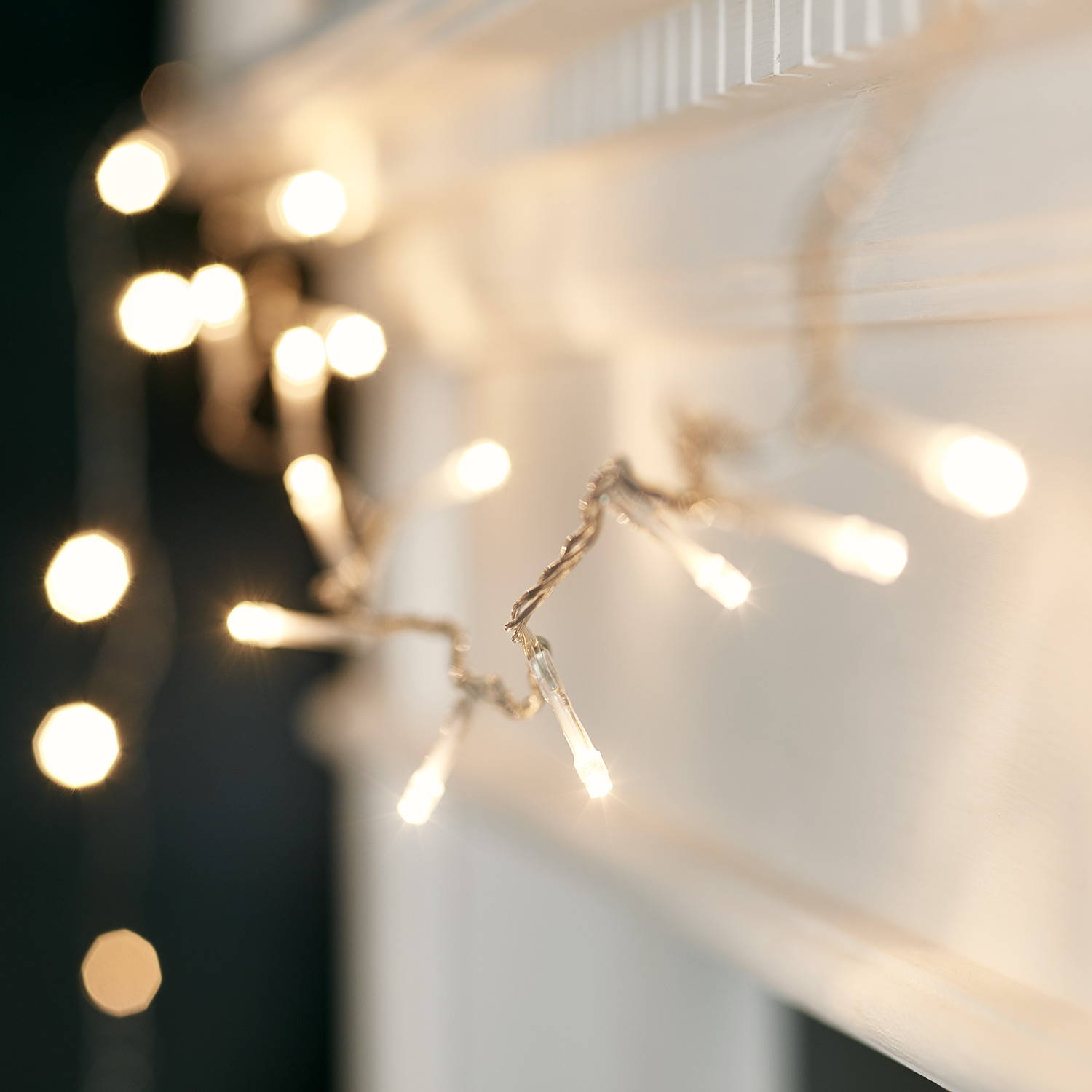 Fairy lights close up with warm white bulbs.