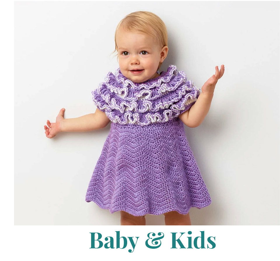 Child in a purple dress with ruffles, smiling and gesturing.