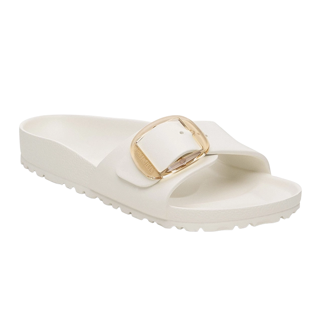 White slide sandal with a gold buckle detail.