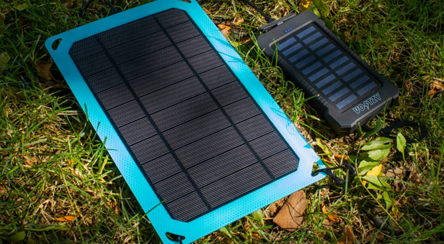 Voltzy Powerbank and Voltzy Solar charging in the sunlight. 