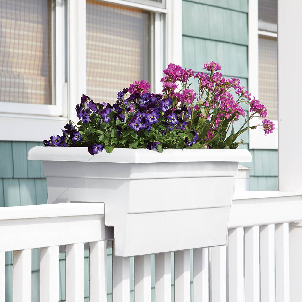 White railing planter with pink and purple flowers