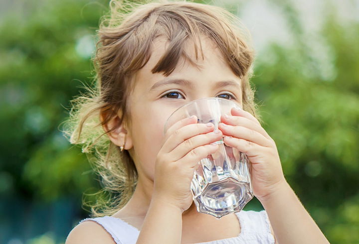 Girl drinking glass of water - mobile cover
