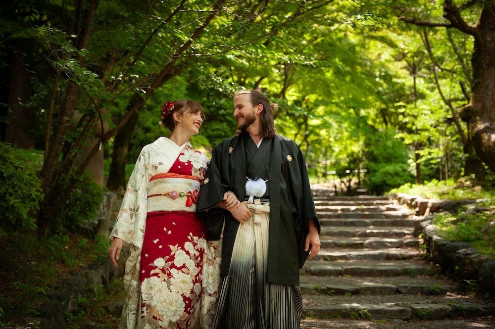 engaged couple wearing kimono, walking down steps, kyoto japan