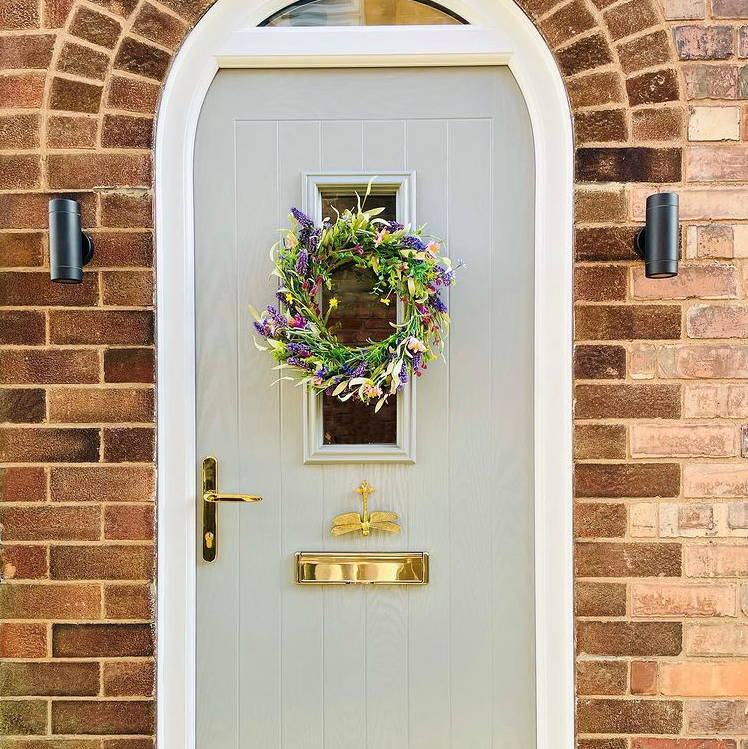 Customer photo (@renovating_dale_abode) featuring front door, outdoor mains lights and artificial wreath
