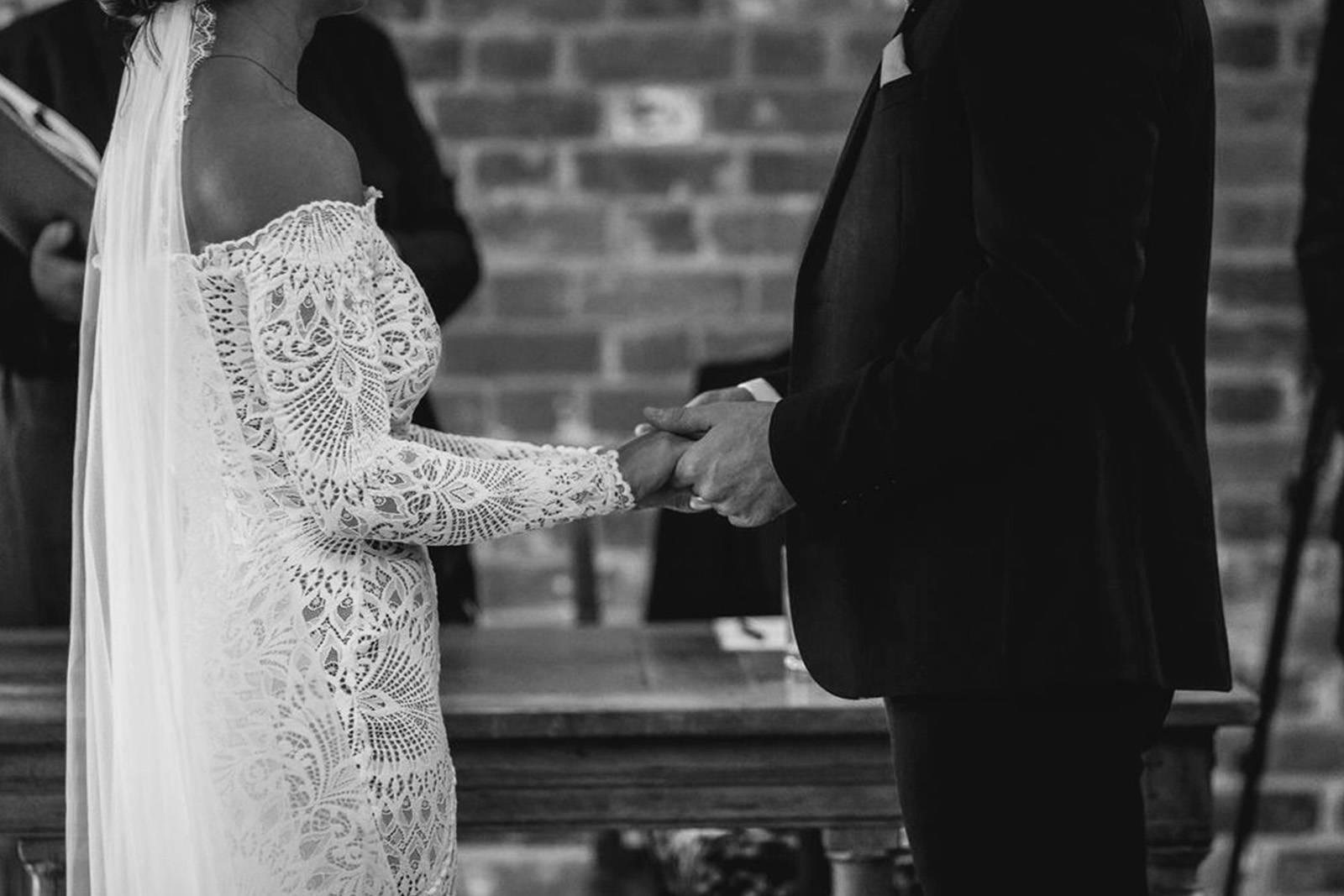 Groom and bride in the nathalia lace gown