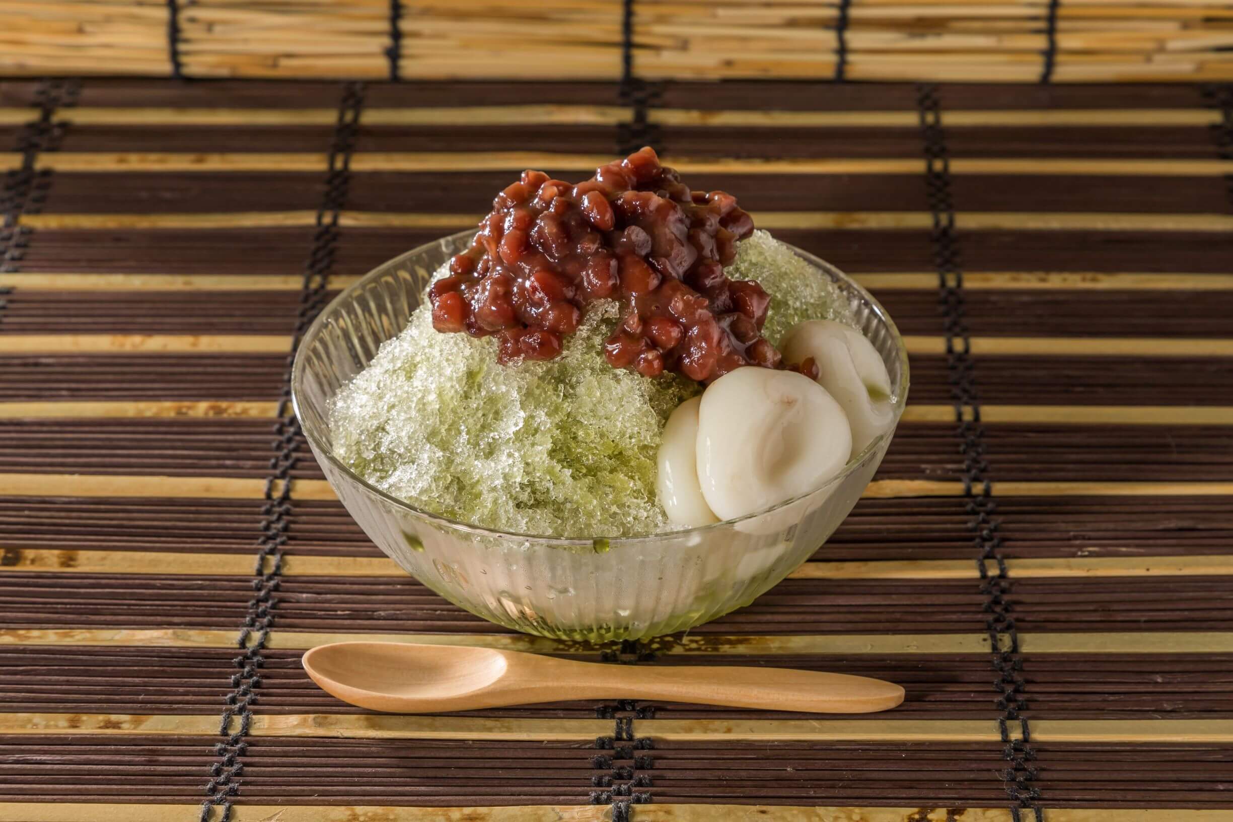 matcha flavor kakigori topped with dango and red bean paste