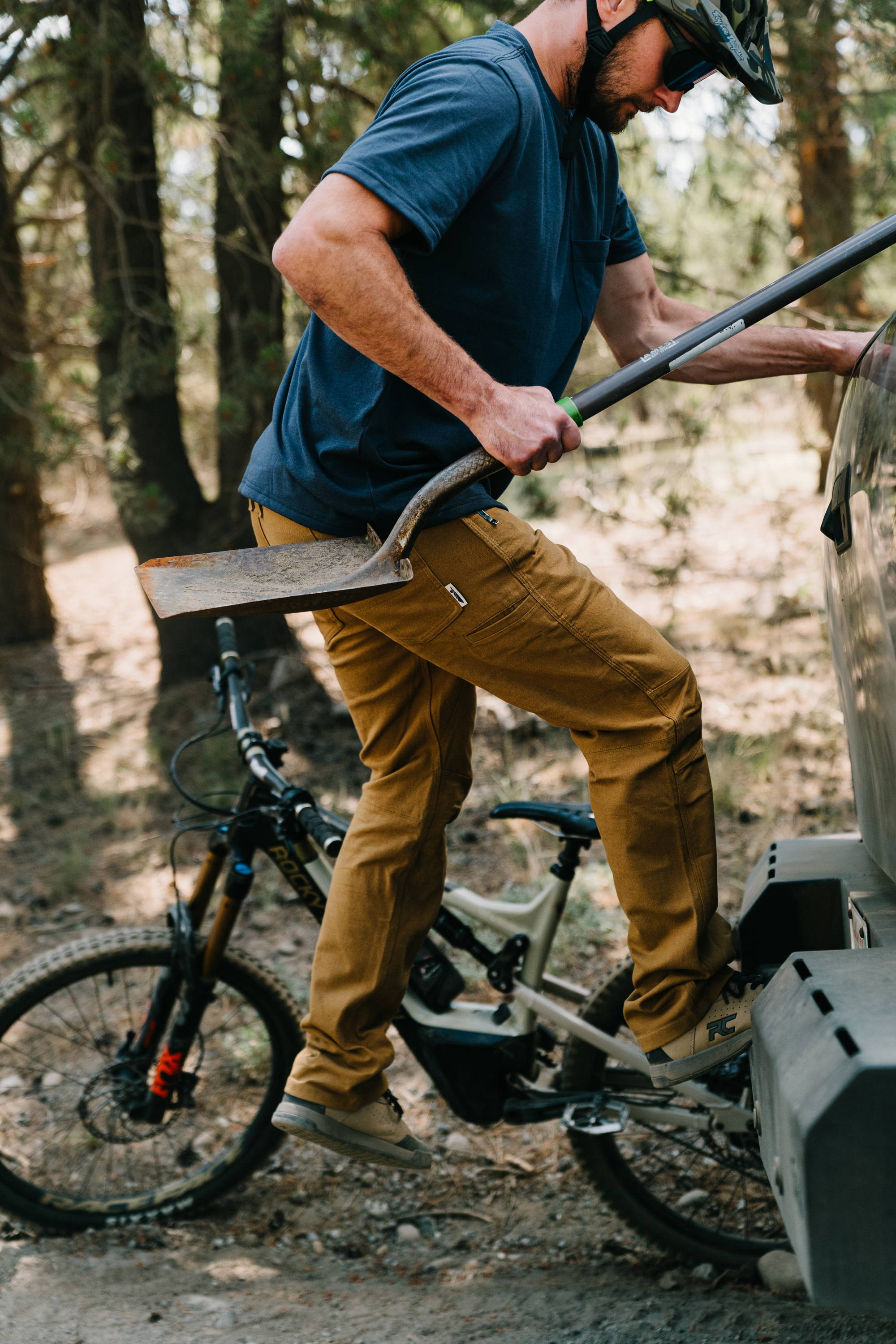 Cast Iron Sierra Pant in the field, mountain bike in the background