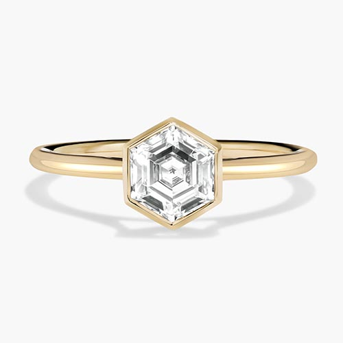 Custom lab grown diamond ring design with a hexagon cut center stone in 14k yellow gold metal