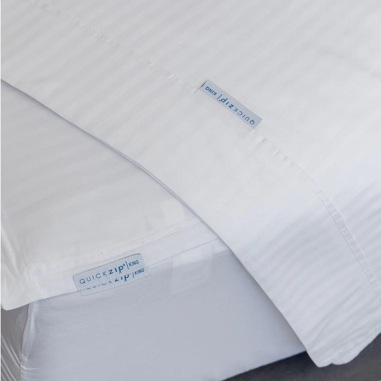 ComfortCore Flat sheet in Sateen Stripe atop a QuickZip Fitted Sheet also in ComfortCore Sateen Stripe