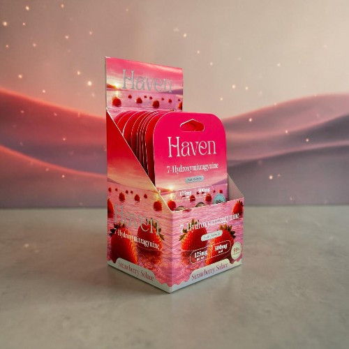 A display box of Haven products against a soft pink background.