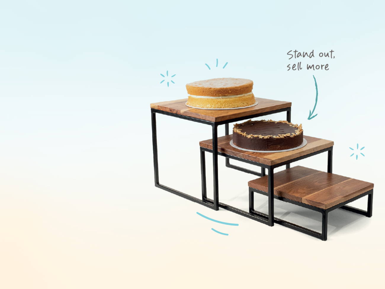 Refresh your space - three dark wooden risers with cakes on them and the text Stand out, sell more