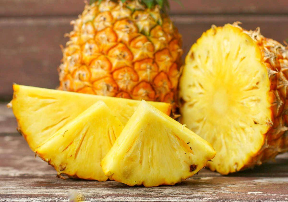 Sliced and whole of Pineapple(Ananas comosus) on wooden table background | Foods For Sinus Health & Ways To Relieve Infection | ways