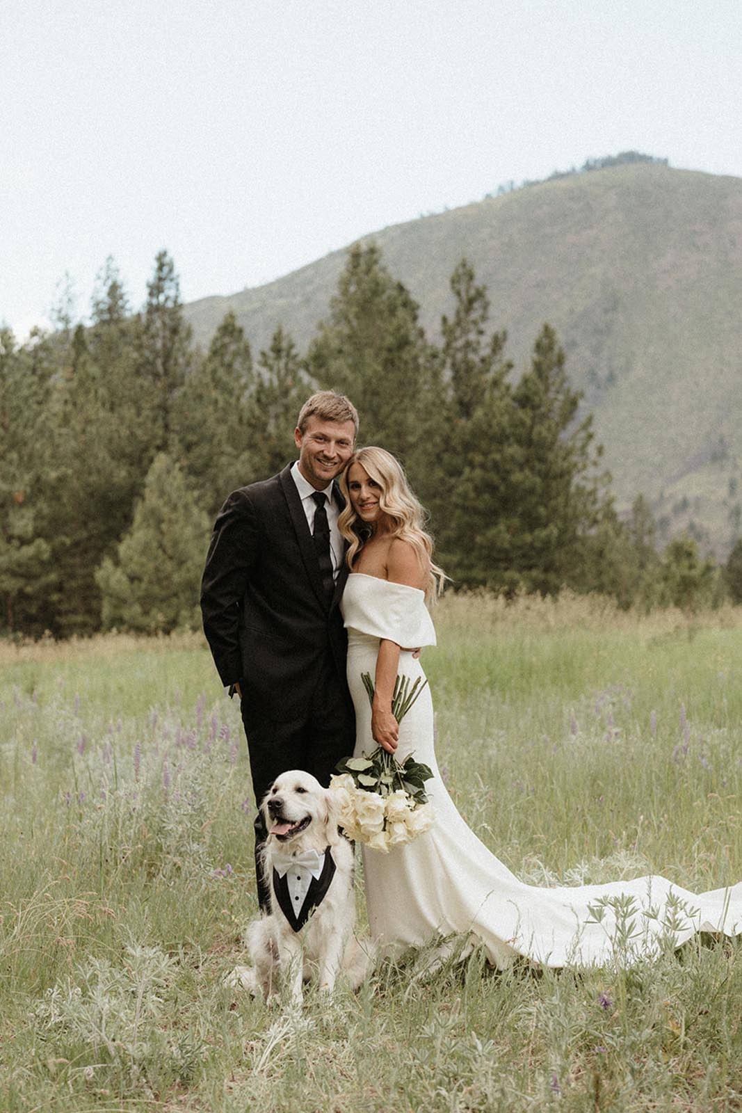 Family picture with the bride, groom and dog