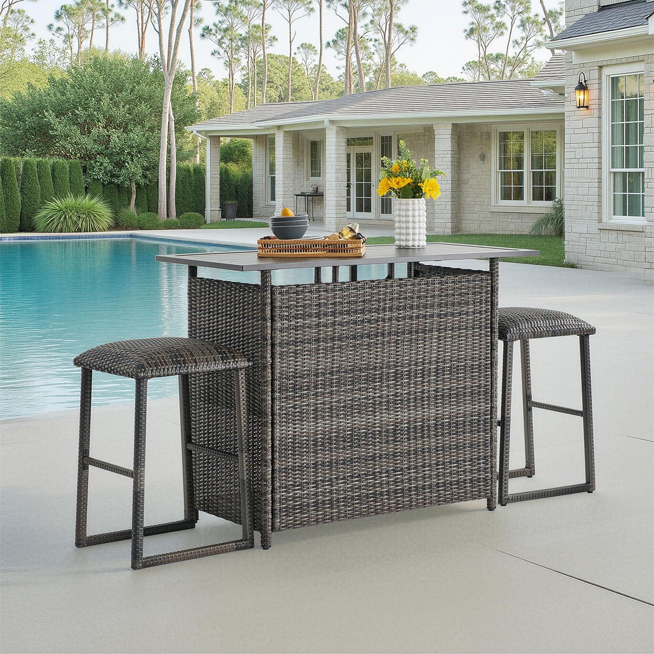 Outdoor bar set with stools beside a swimming pool.