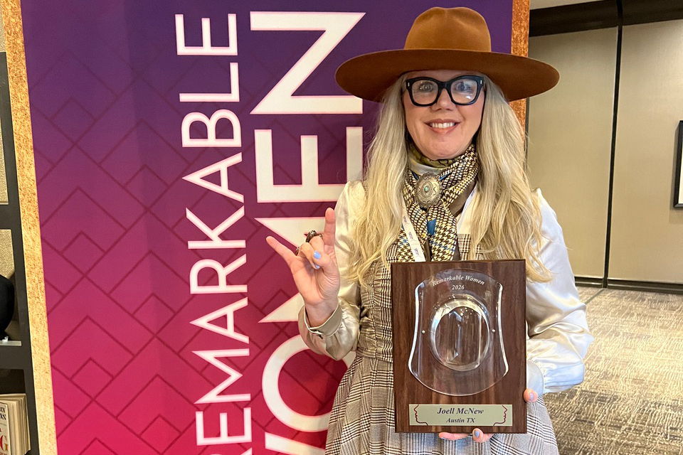 Joell McNew with her Remarkable Women Award. 