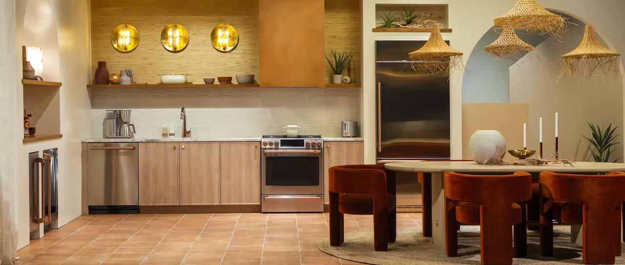 Cafe Desert Daydream kitchen with stainless steel appliances and brushed copper hardware