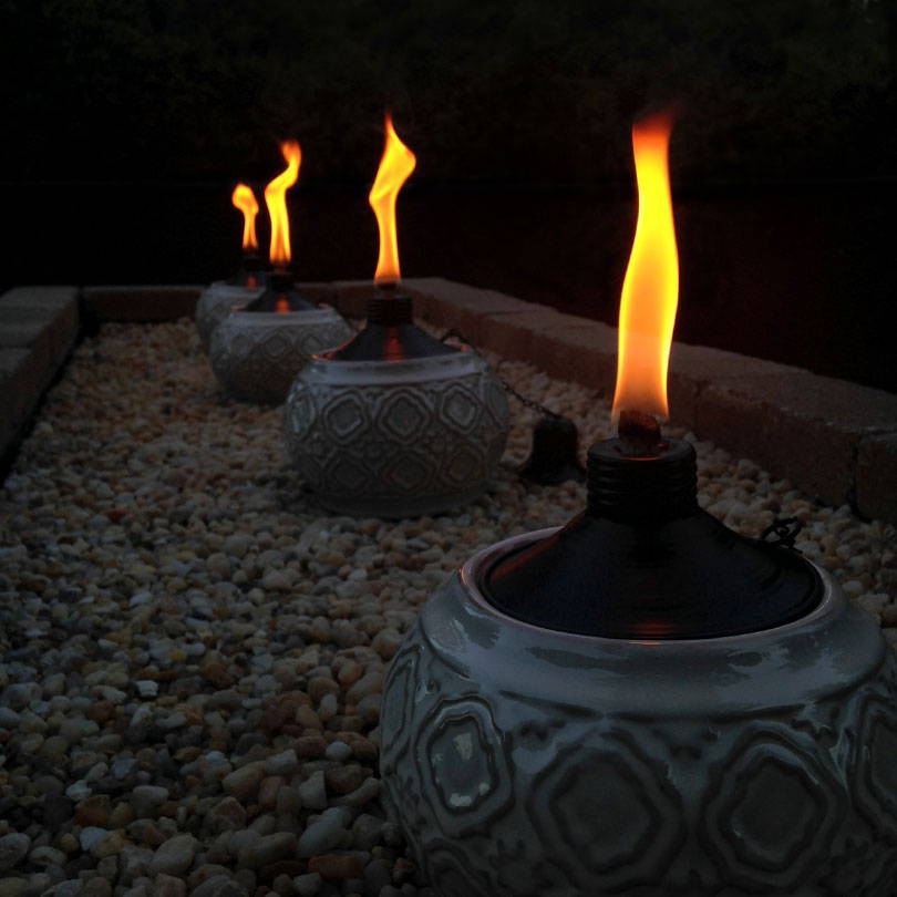 add lighting and torches to your backyard creation