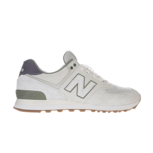 New Balance sneaker in light gray with green and white accents.