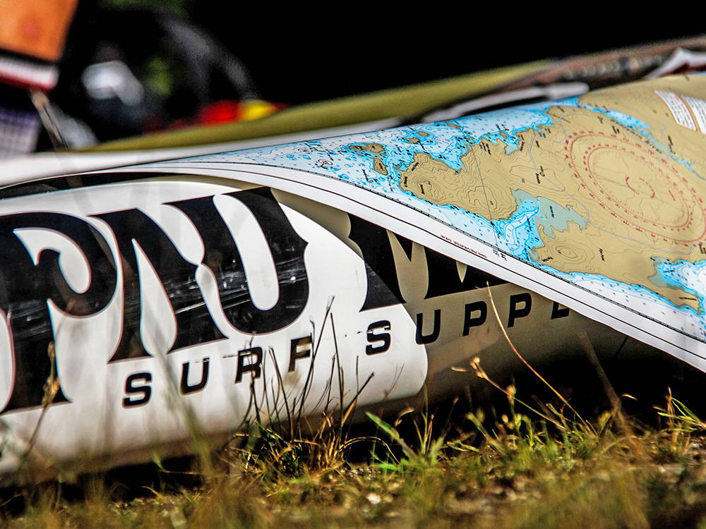a map laid over a stand up paddleboard