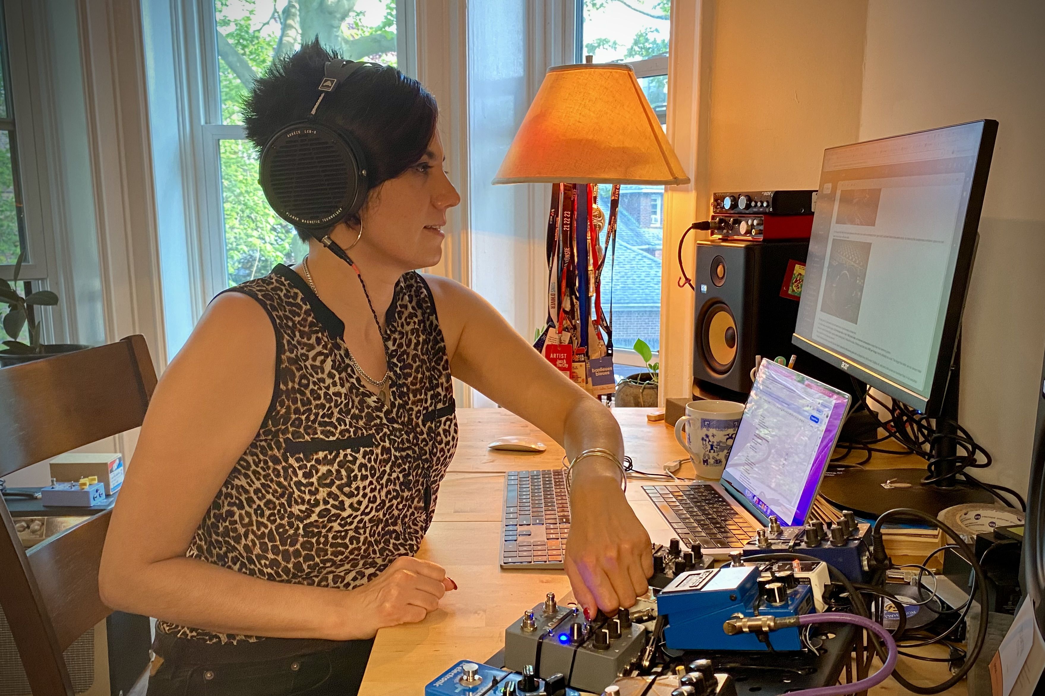 Ava Mendoza wearing Audeze LCD-X headphones in the studio 