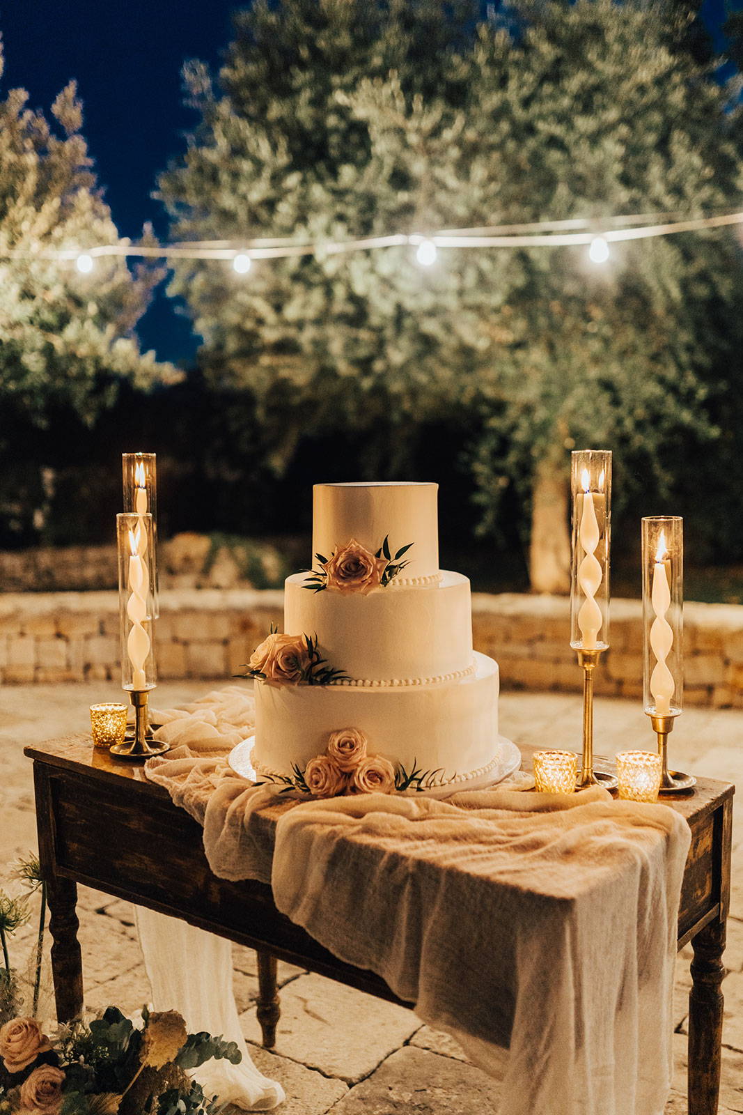White wedding cake with golden tones
