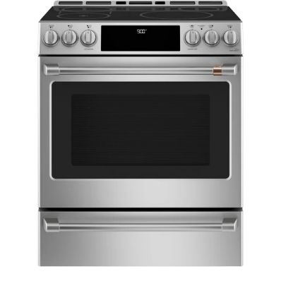 Stainless steel kitchen range with oven and control knobs on top.