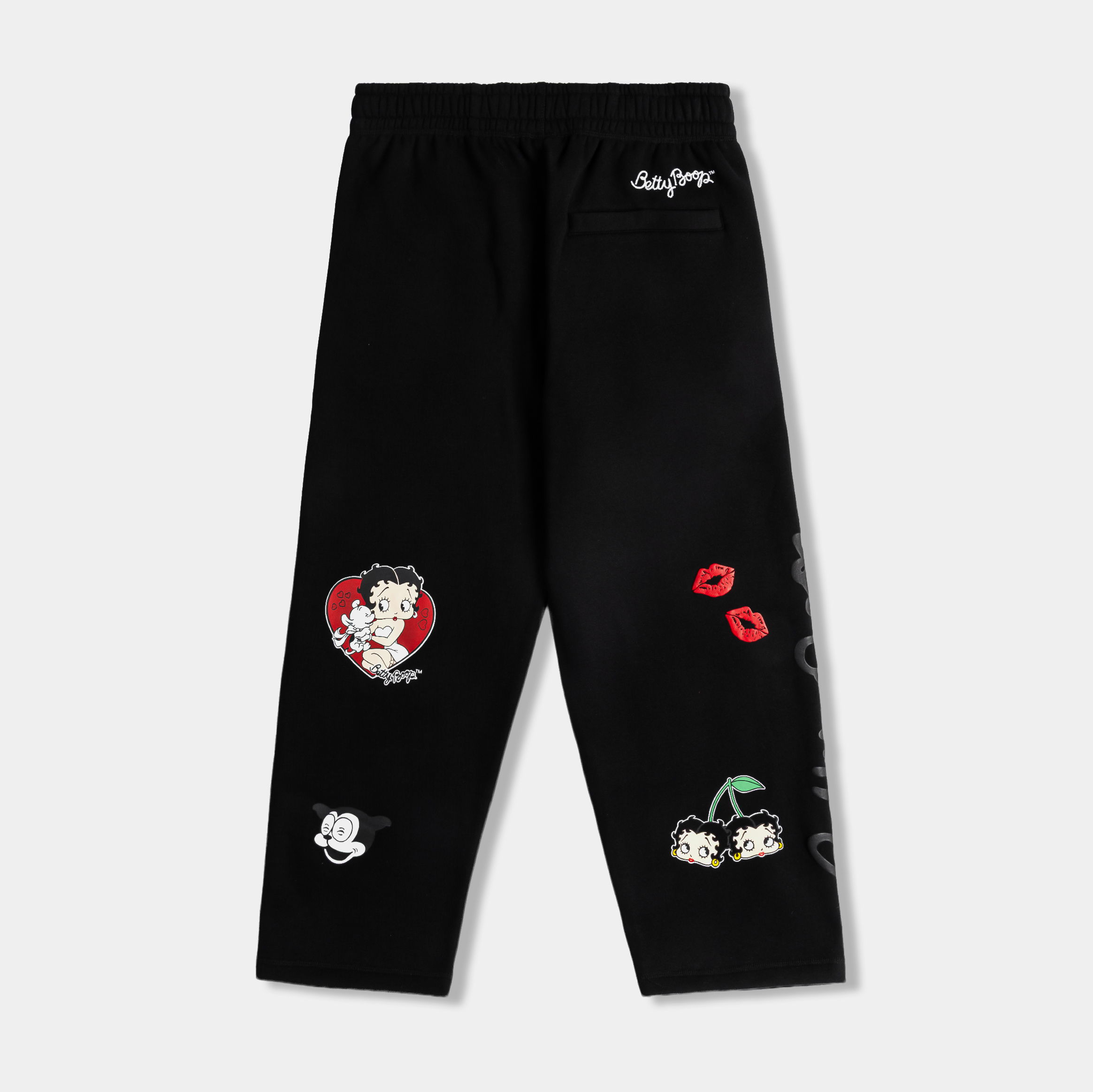 Black pants with colorful graphic designs and text.