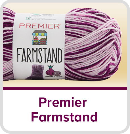 Skein of Premier Farmstand yarn in purple and white stripes.
