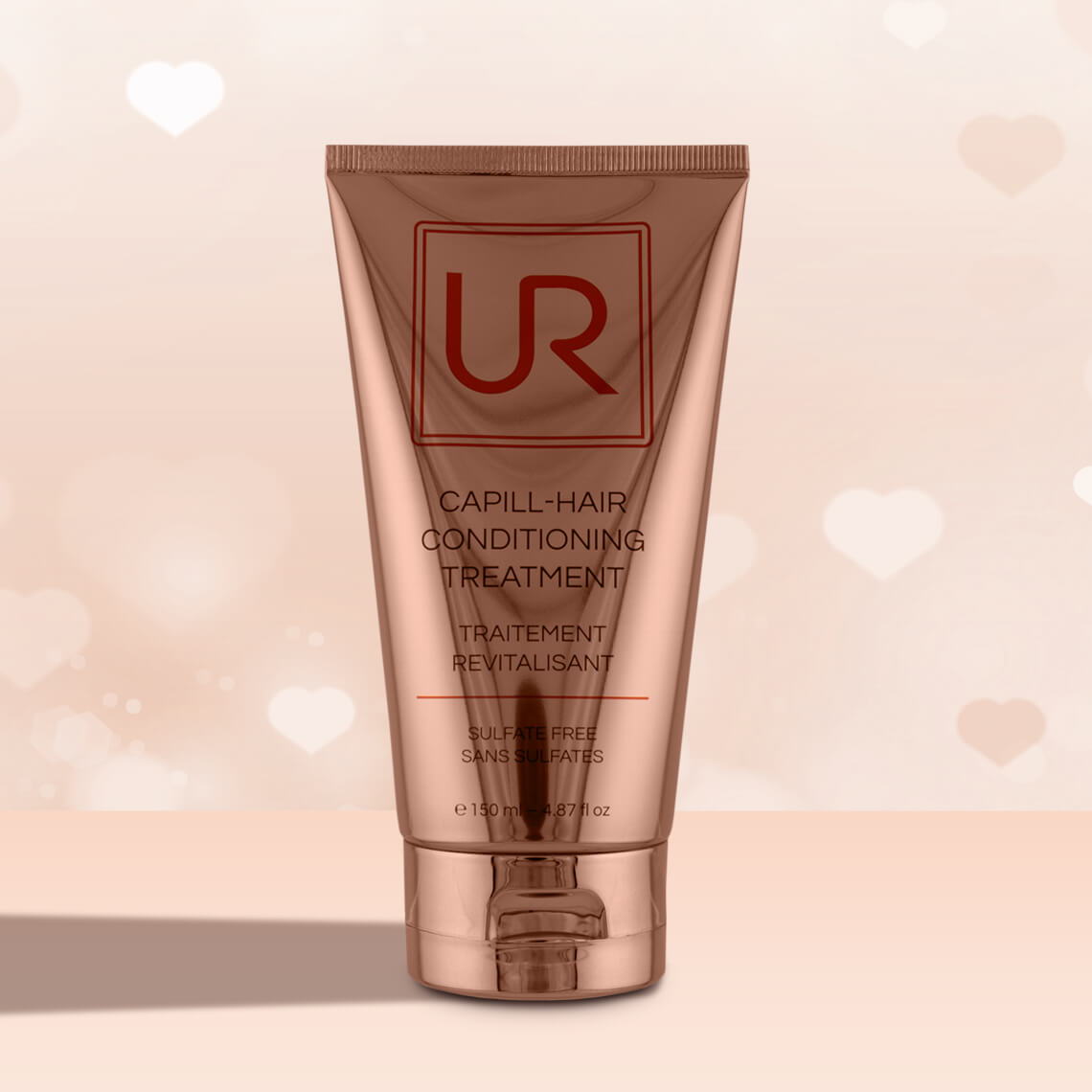 UR Capill-Hair conditioner treatment tube on a soft background.