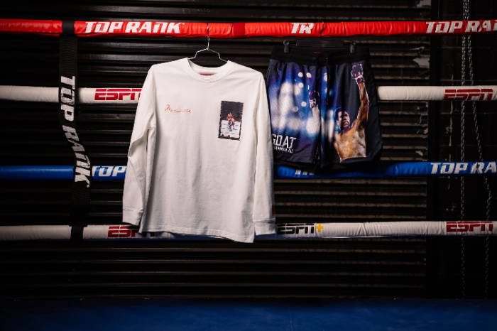 ali long sleeve and shorts hanging on boxing ring