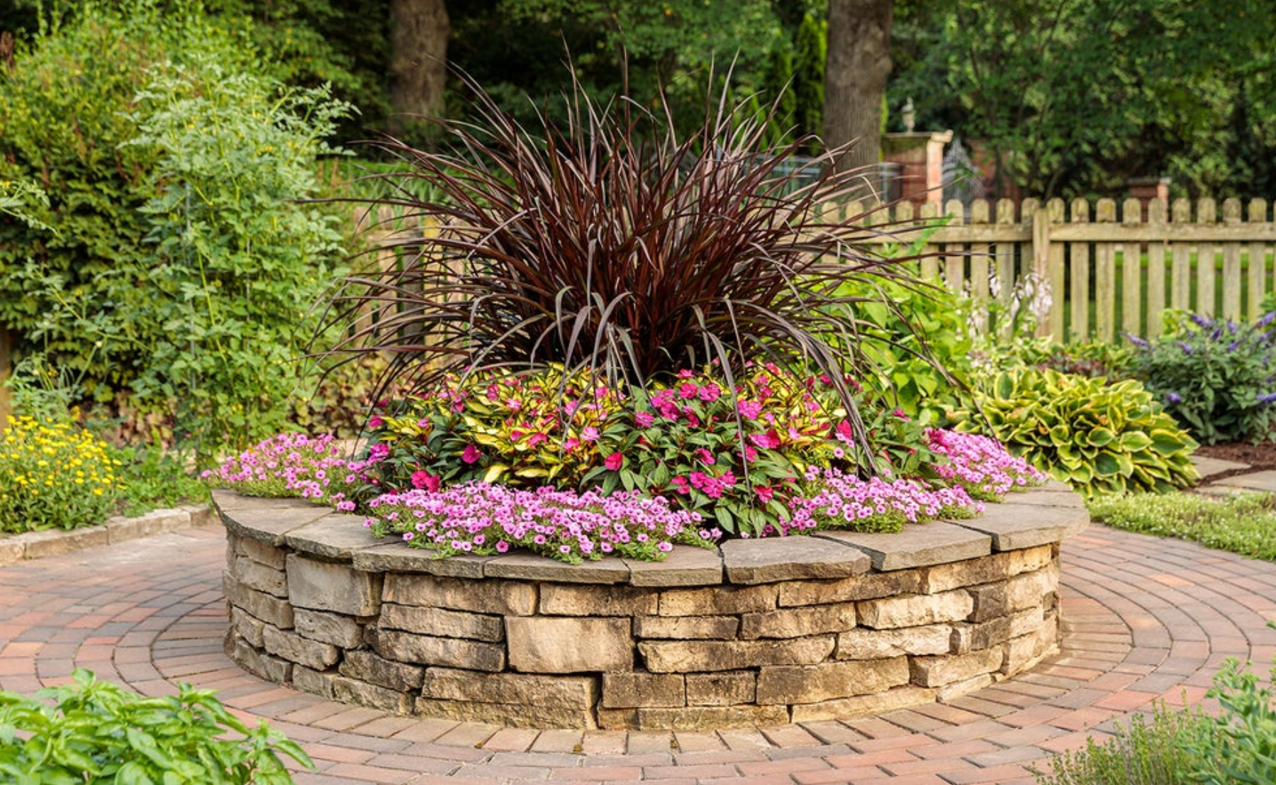  SunPatiens® Compact Neon Pink, Supertunia Mini Vista® Hot Pink, SunPatiens® Compact Tropical Rose, Graceful Grasses® Vertigo® 