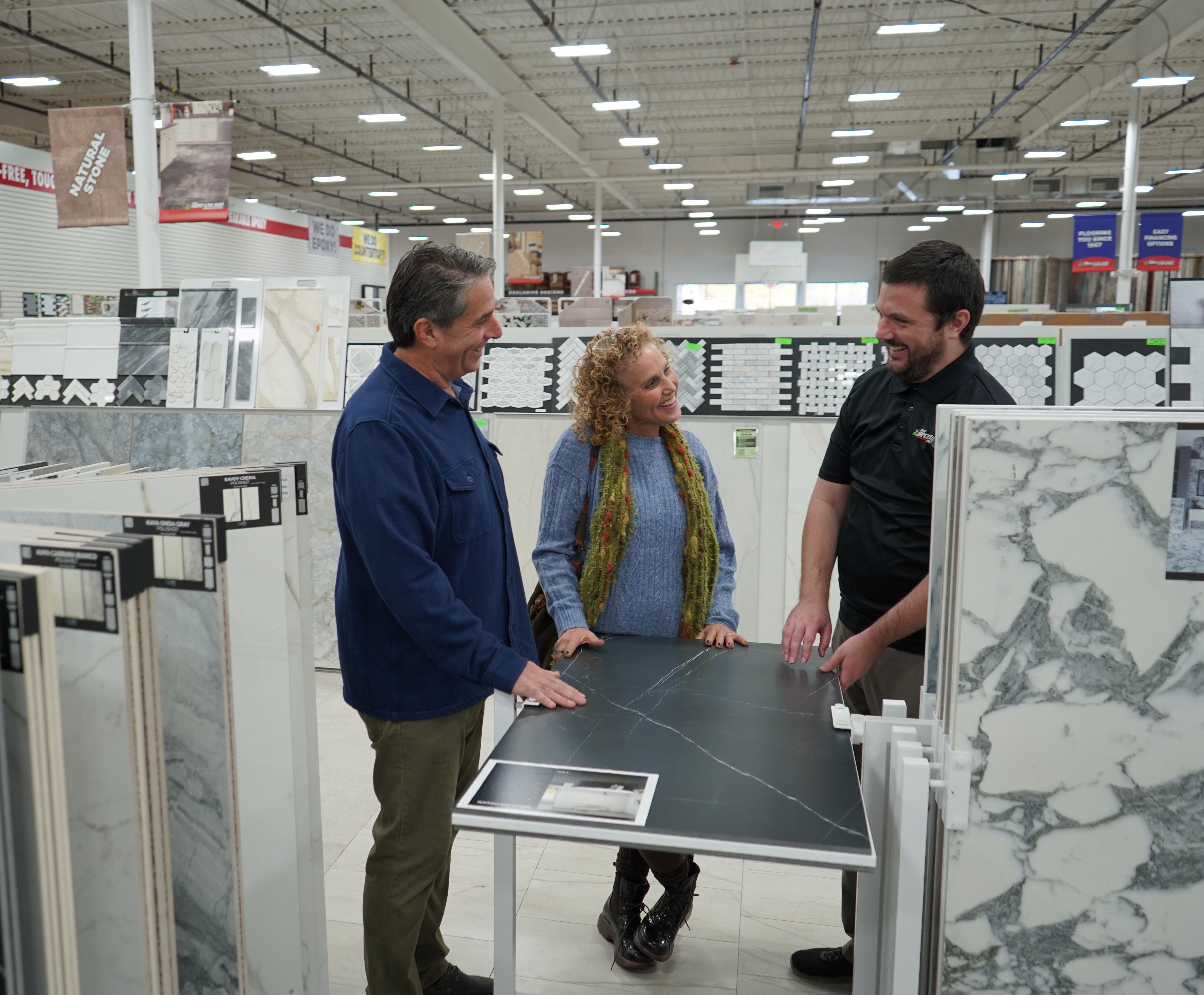 people looing at tile options at a flooring store