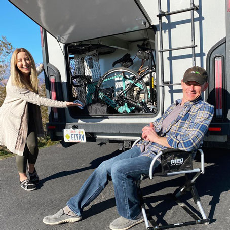 Stefany and James showing the storage of their RV.