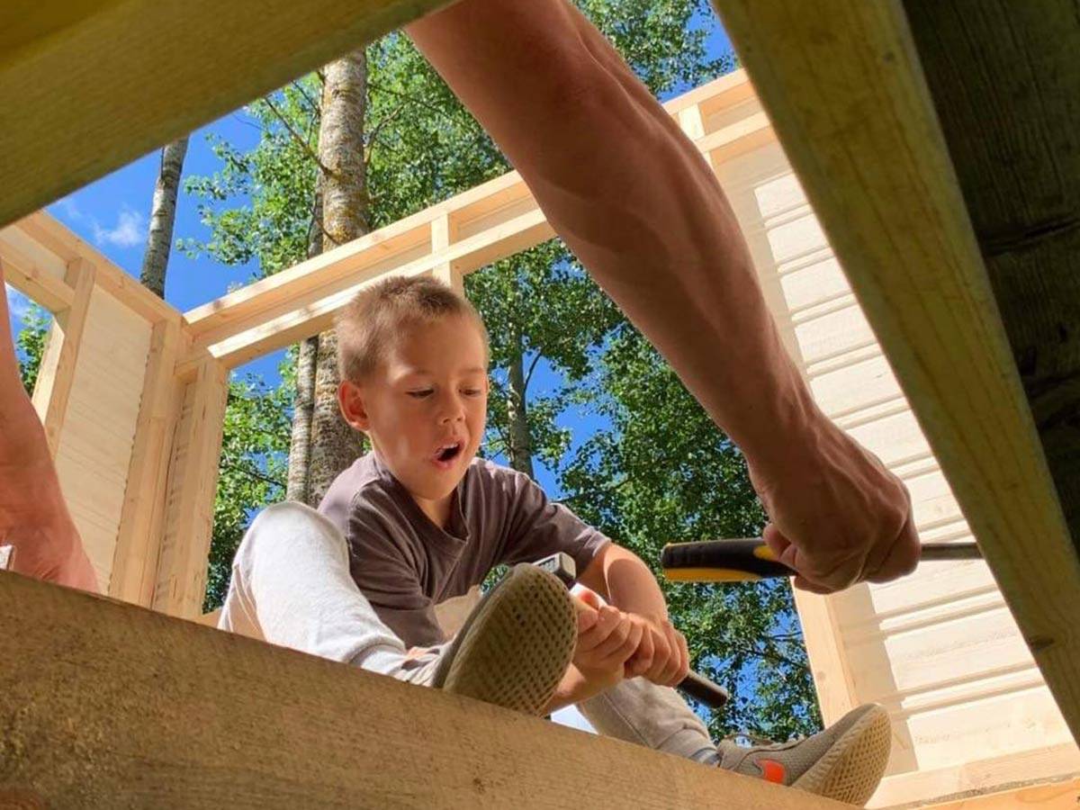 Son and dad assemble Kids DIY  Playhouse by WholeWoodPlayhouses
